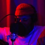 Musician recording vocals in a studio