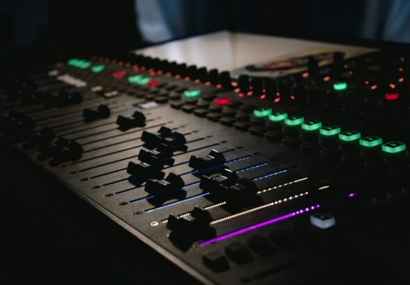 Audio engineer's mixing console in a radio studio